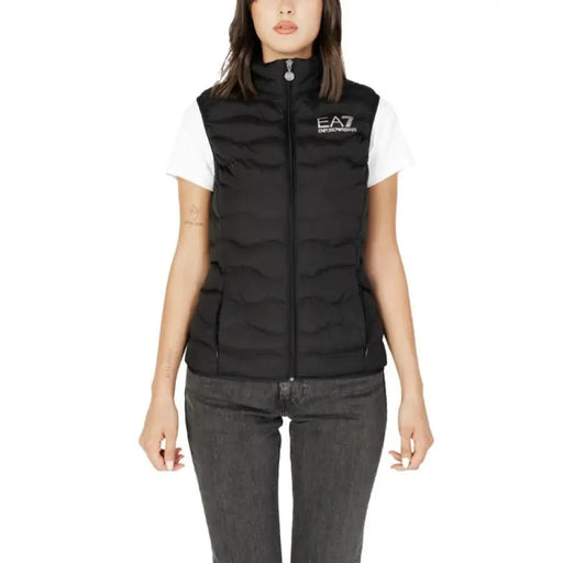 Black quilted EA7 vest over a white t-shirt from EA7 Women’s Gilet collection