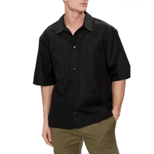 Black short-sleeved button-up worn by person, Calvin Klein Jeans Men Shirt