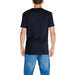 Black short-sleeved Calvin Klein Jeans t-shirt worn with blue jeans