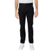 Tommy Hilfiger black straight-leg trousers paired with white sneakers for men