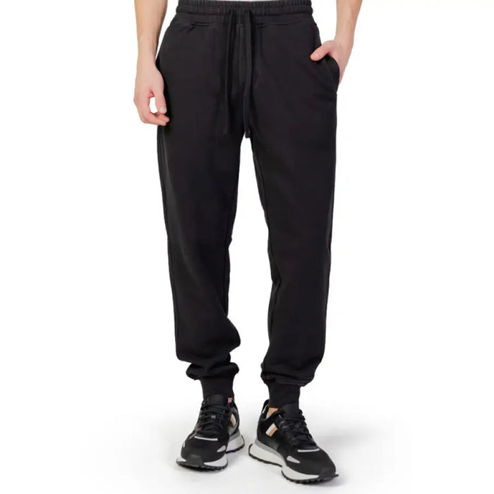 Black Liu Jo Men Trousers featuring elastic cuffs and drawstring waist for stylish comfort