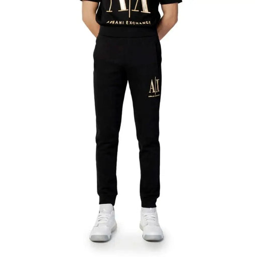 Black Armani Exchange sweatpants with gold ’A|X’ logo on the left thigh