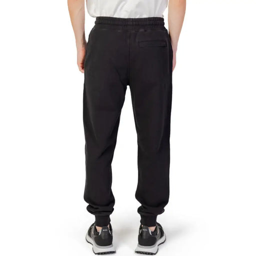 Black Liu Jo Men Trousers viewed from the back, perfect for stylish men’s apparel & accessories