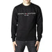 Black sweatshirt featuring TOMMY HILFIGER EST. 1985 text for men by Tommy Hilfiger