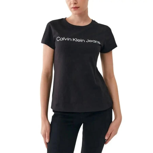 Black Calvin Klein Jeans Women’s T-shirt featuring logo text on the front