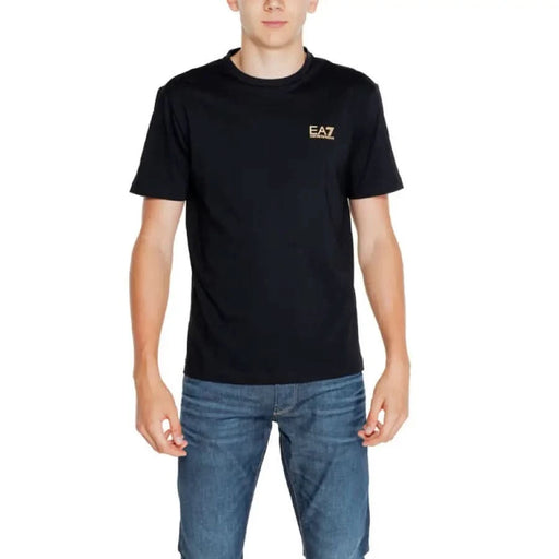 Black EA7 Men T-Shirt featuring a gold EA7 logo prominently displayed on the chest