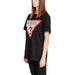 Black t-shirt with a prominent Guess triangle logo on the front from Guess Women Knitwear