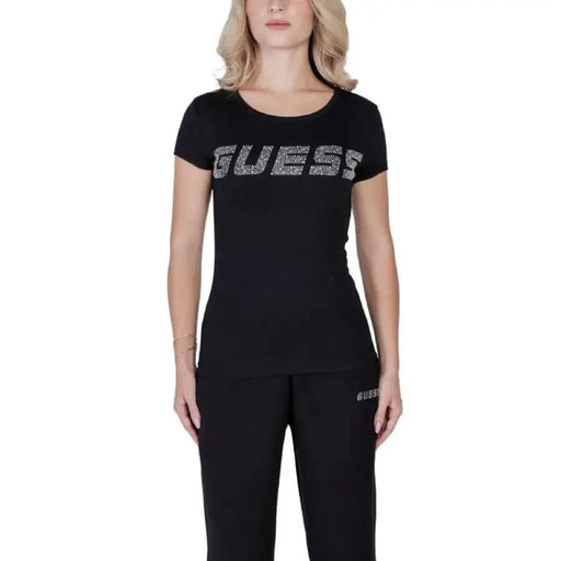 Black Guess Women T-Shirt featuring sparkly logo text across the chest