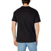 Black t-shirt from Tommy Hilfiger Jeans worn by a person facing away