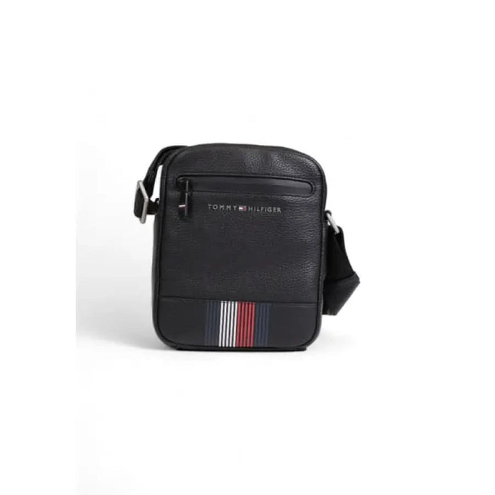 Black Tommy Hilfiger messenger bag featuring a striped logo accent for men