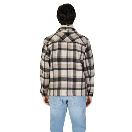 Black and white plaid flannel jacket paired with light blue jeans from Gas Men Shirt