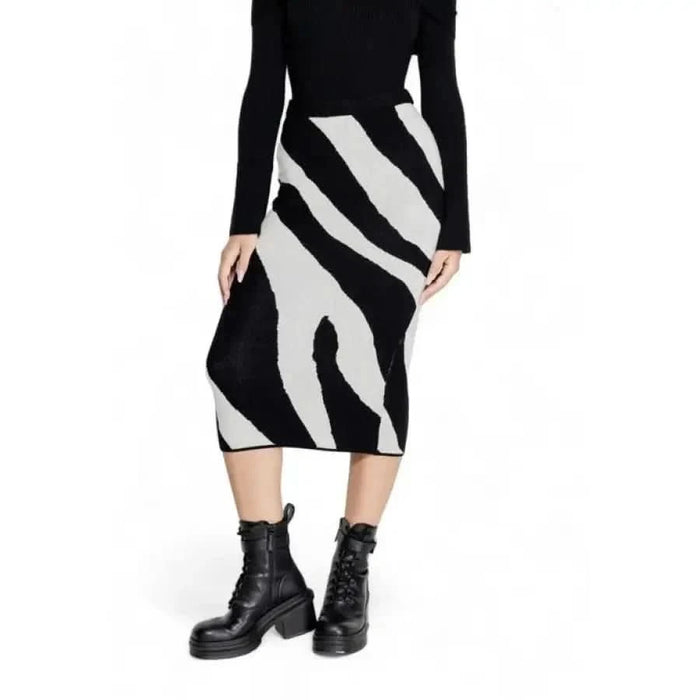 Black and white zebra-print midi skirt with black combat boots by Vero Moda