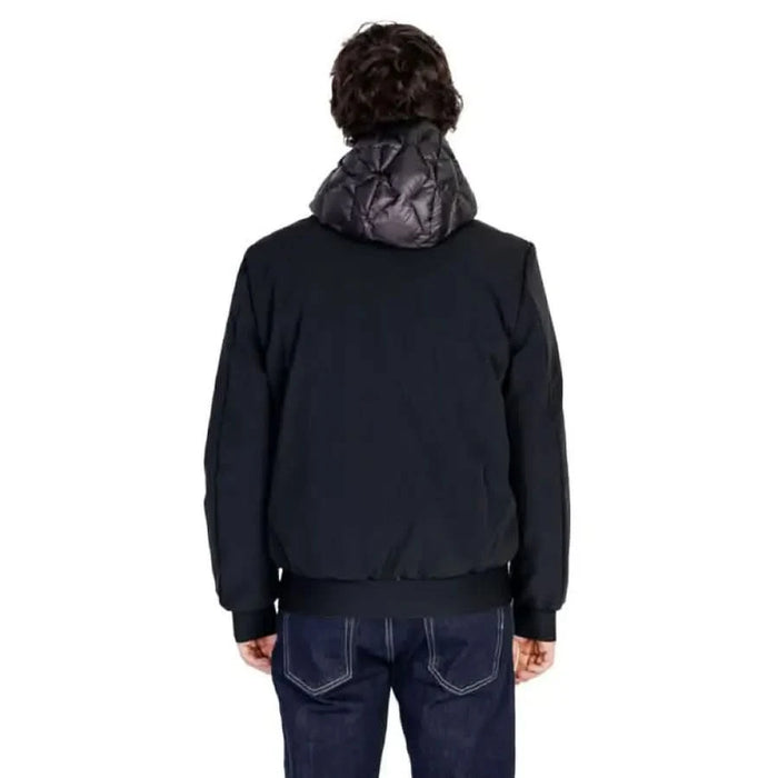 Black winter jacket with padded hood displayed from the back by Peuterey