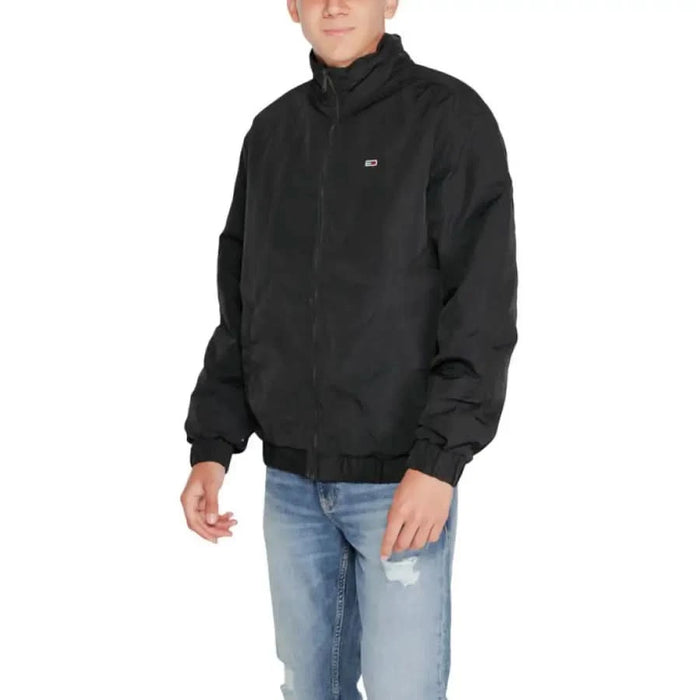 Black zip-up Tommy Hilfiger men jacket with high collar and small logo on chest