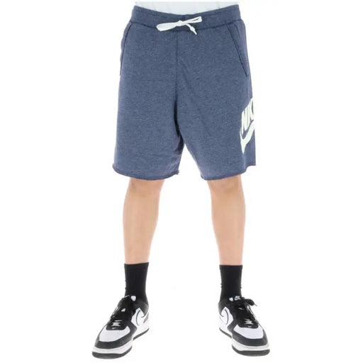 Blue Nike athletic shorts featuring a white drawstring and the iconic Nike logo