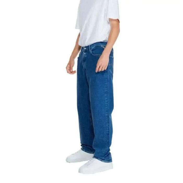 Blue denim jeans styled with a white shirt and shoes from Replay Men Jeans