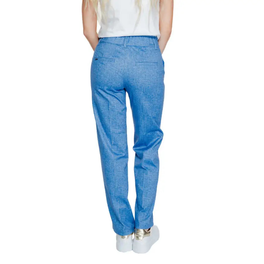 Blue linen chambray trousers paired with white sneakers from Street One Women Trousers