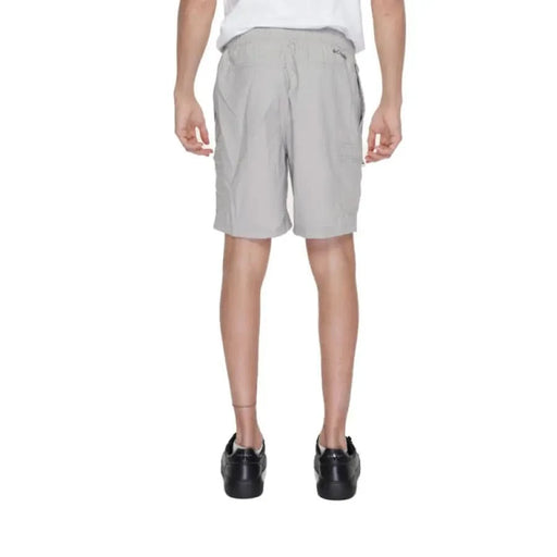 Boy in Columbia Men Shorts showcasing urban city style clothing