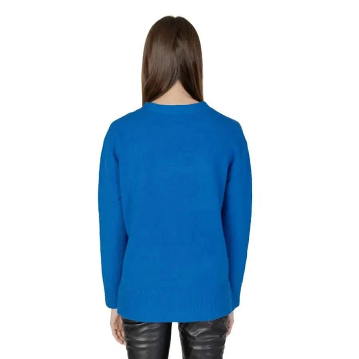 Bright blue long-sleeved Street One sweater on person with long brown hair