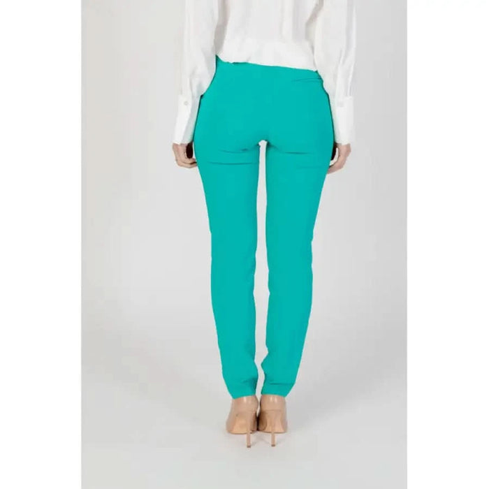 Bright turquoise skinny pants with back pockets from Rinascimento Women Trousers