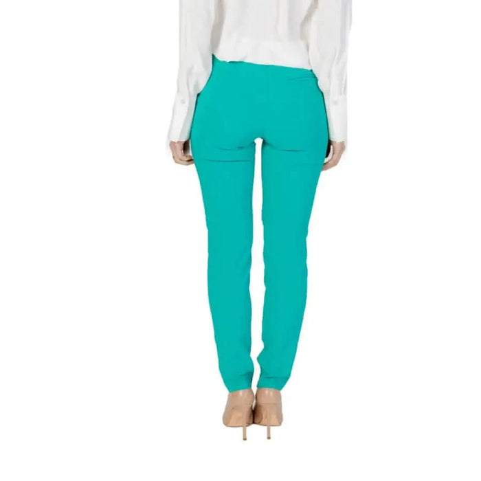 Bright turquoise skinny pants with back pockets from Rinascimento Women’s Trousers