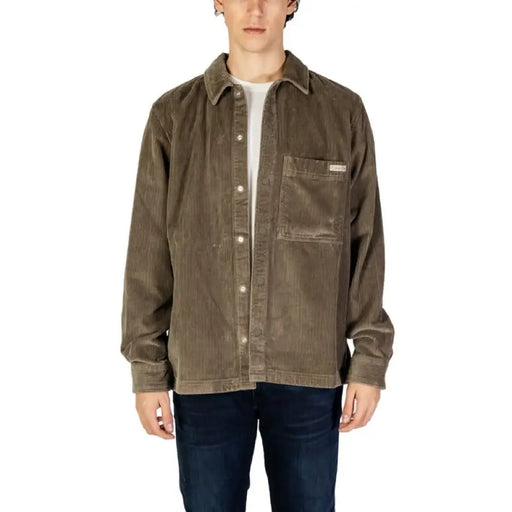 Brown corduroy shirt jacket by Calvin Klein Jeans with snap buttons and chest pocket