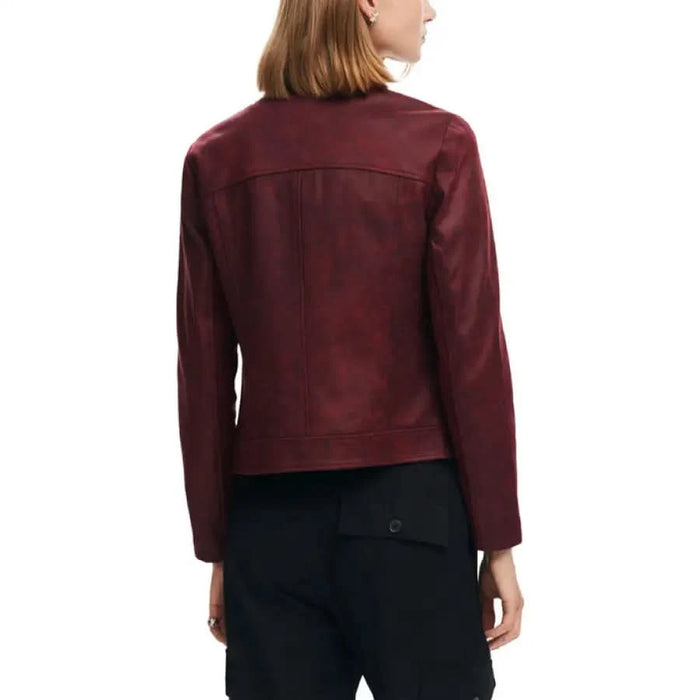 Desigual Women’s Burgundy Leather Jacket displayed from the back on a person