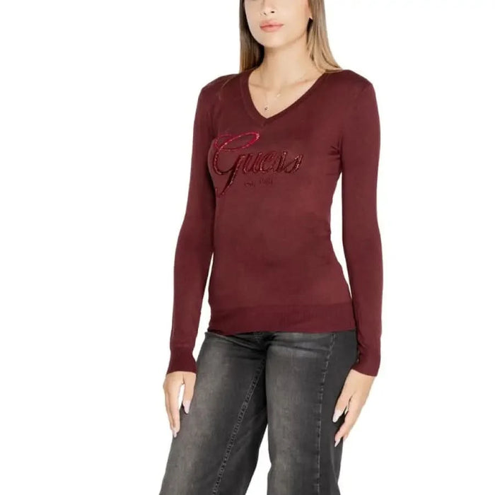 Burgundy long-sleeved V-neck top with Guess logo embroidered on the chest