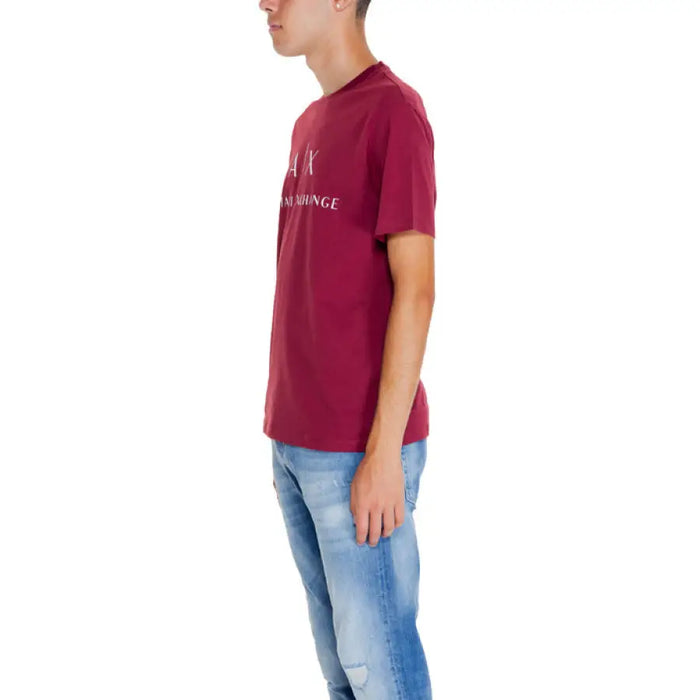 Burgundy Armani Exchange t-shirt with text print paired with blue jeans