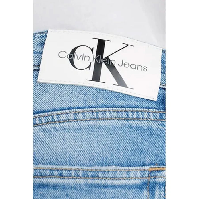 Calvin Klein Jeans label stitched onto premium denim fabric for men’s jeans