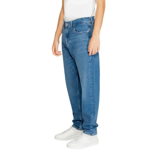 Classic blue straight-leg denim jeans with five-pocket styling by Tommy Hilfiger