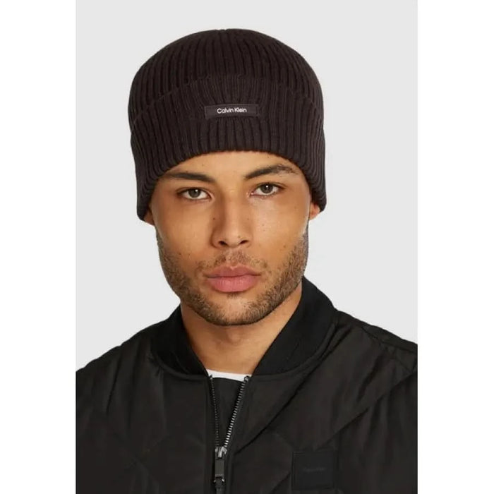 Dark brown knit beanie featuring the Calvin Klein logo, part of the Calvin Klein Men Cap