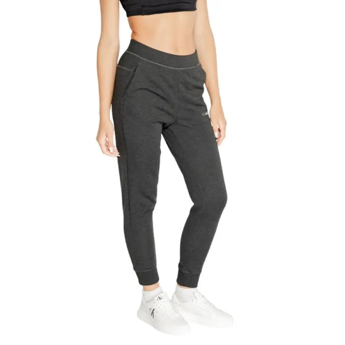 Dark gray Calvin Klein Sport women’s jogger pants with tapered legs and elastic waistband