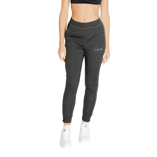 Dark gray tapered jogger pants with elastic waistband by Calvin Klein Sport for women