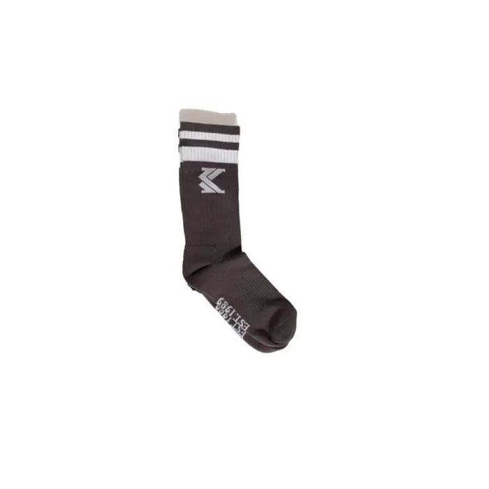 Dark gray athletic sock with white stripes and Karl Kani logo near the top