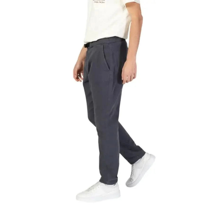 Dark gray Gas Men Trousers jogger pants with elastic cuffs paired with white sneakers