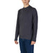 Dark gray long-sleeve crew neck shirt paired with blue pants for men