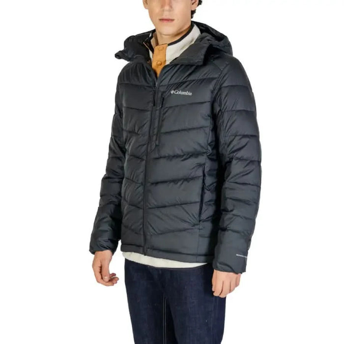 Dark gray puffy winter jacket with hood featuring Columbia branding for men