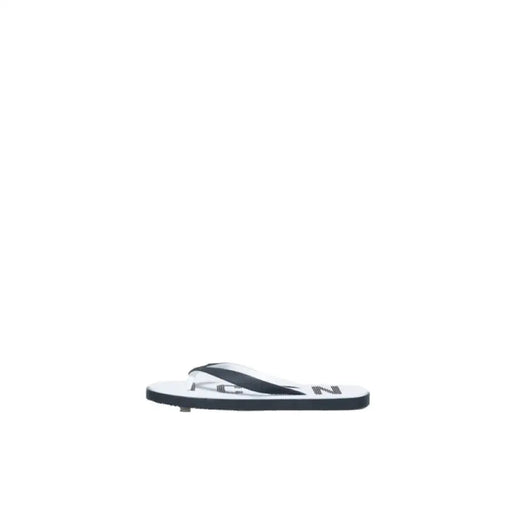 Icon Men Slippers featuring black and white flip-flop sandal design with text