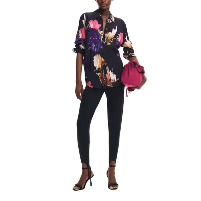 Floral print blouse with ruffled sleeves styled with black pants and high heels