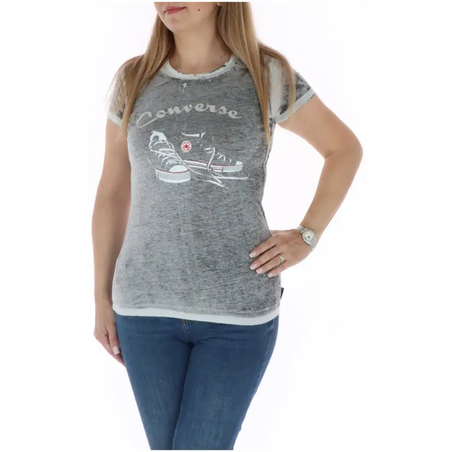 Woman wearing a gray Converse t-shirt with sneaker graphic from ’Converse - Converse Women T-Shirt’