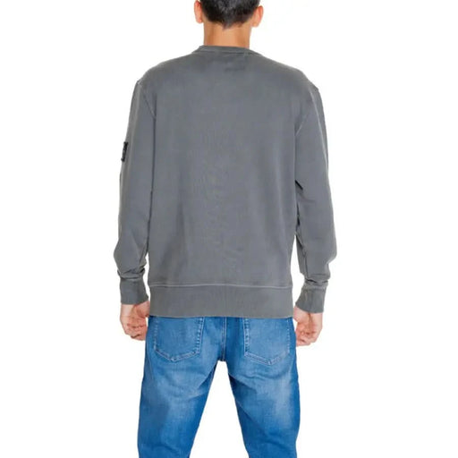 Gray crewneck sweatshirt with blue jeans back view from Calvin Klein Jeans for men