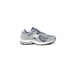 Gray and white New Balance Men Sneakers featuring a prominent N logo on the side