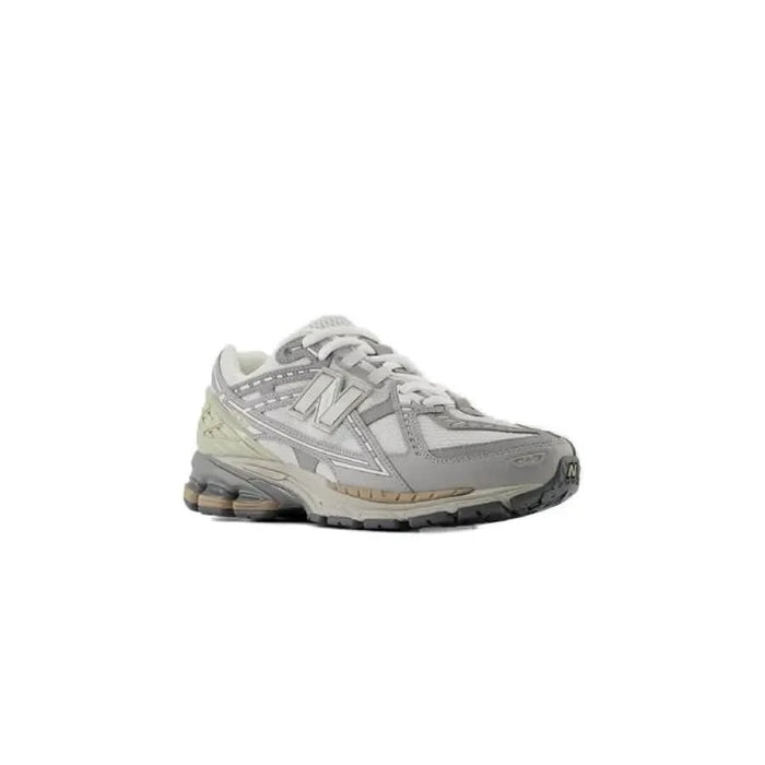 Gray and white New Balance Men Sneakers featuring a chunky sole for athletic performance