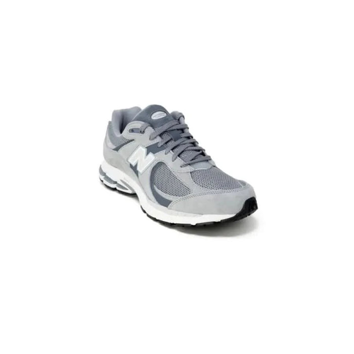 Gray and white New Balance athletic running shoe with mesh and synthetic upper