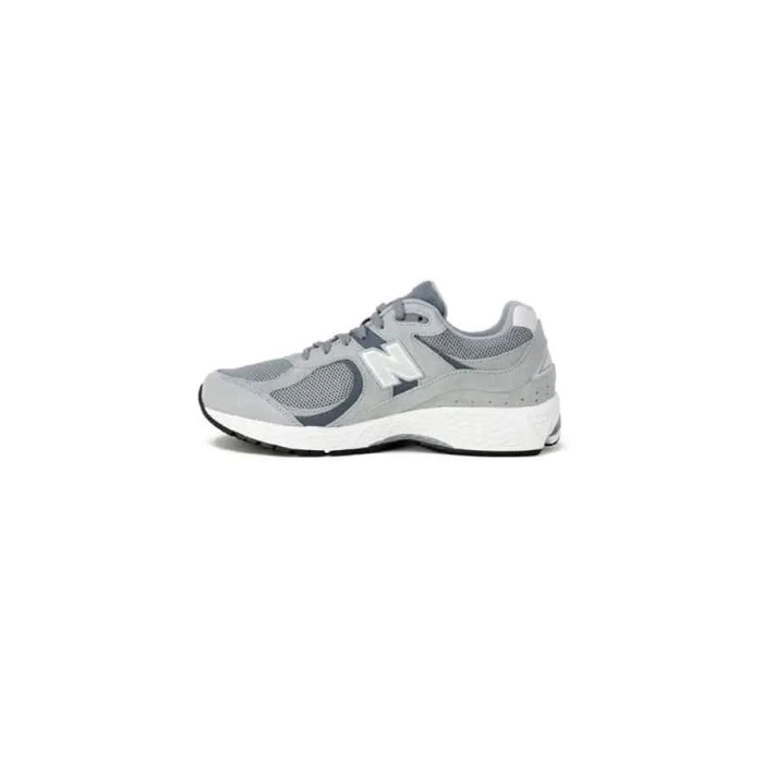 Gray and white New Balance Men Sneakers featuring mesh panels and a chunky sole