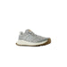 Gray and white New Balance sneaker with gum rubber sole for men