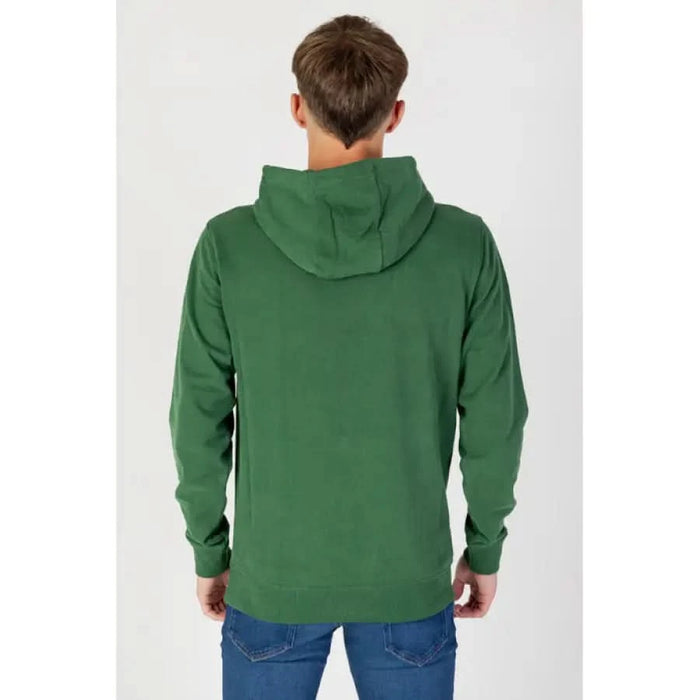 Person facing away wearing green hooded sweatshirt, Tommy Hilfiger Jeans Men Sweatshirts