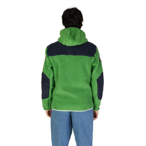 Green and navy blue fleece jacket with shoulder panels displayed from the back