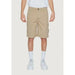 Khaki cargo shorts by Calvin Klein Jeans worn with white shirt and sneakers